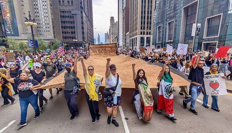 The We the People scroll stretches across the crowd during Chicagos Oct. 18 No Kings demonstration. (Courtesy Photo)