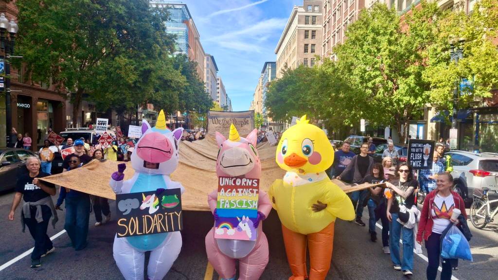 Marchers hold the We the People scroll at the Oct. 18 No Kings demonstration in Washington, D.C. (Courtesy Photo)