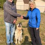 Northwest Battle Buddies founder and CEO Shannon Walker shakes hand with Charles and Dodger, his Battle Buddy. Photos courtesy of Northwest Battle Buddies