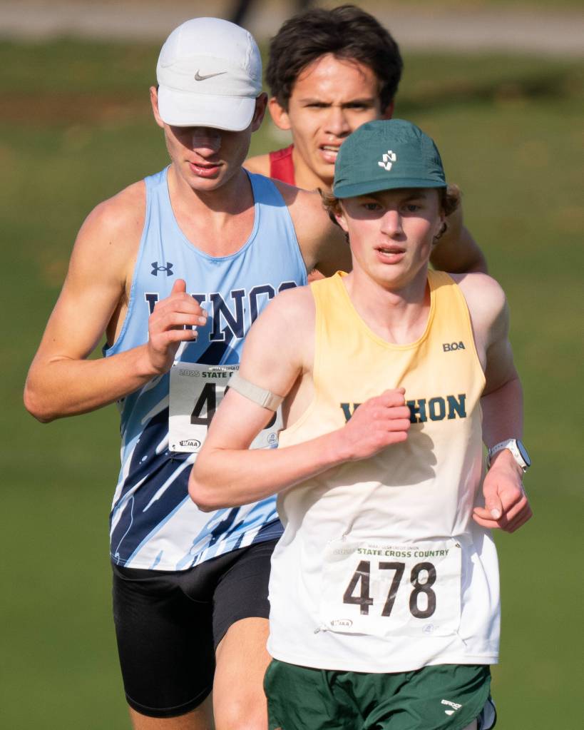 Junior captain Josh Healey races to a fifth-place overall finish at the state cross-country championships in Pasco on Nov. 8. (John Decker Photo)