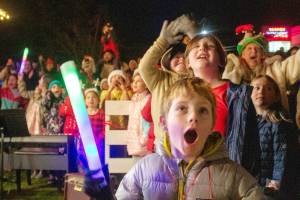 Alex Bruell Photo
Kids and adults react as the great tree lights up next to the Vashon Presbyterian Church at WinterFest 2024.