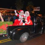 Mr. and Mrs. Claus wave to their fans as the parade rolls through town. (Jim Diers Photo)