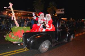 Mr. and Mrs. Claus wave to their fans as the parade rolls through town. (Jim Diers Photo)