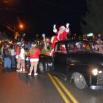 Mr. and Mrs. Claus wave to their fans as the parade rolls through town. (Jim Diers Photo)