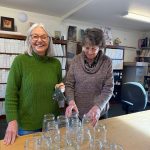 Vashon Heritage Museum volunteers, Susan Martin and Jenny Lewis, with supplies for the the museums Family Day on Dec. 20. Children will have the opportunity to decorate a glass jar with tissue paper for a colorful lantern. Susan is holding a woven ornament, another craft opportunity for families. (Courtesy Photo)