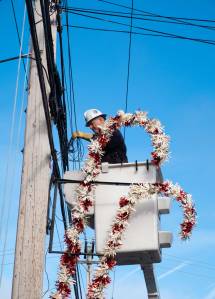 Terry Donnelly Photo
Wes Peterson installs and wires candy cane decorations Dec. 2024.