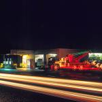 Engles service station with tow truck decorated in holiday lights at night in 2015. (Terry Donnelly Photo)