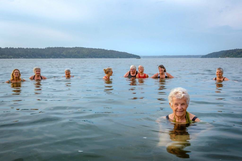 October: Jill Andrews, front right, swims one morning with her island swim club. (Terry Donnelly Photo)