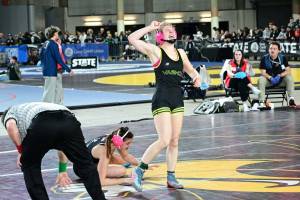 Tony Puz Photo
February: Lena Puz celebrates her win over South Whidbeys Kaylie Baker at the Mat Classic state wrestling championships.