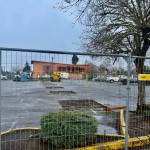 Part of the construction site currently occupies much of the parking lot outside IGA at Vashon Plaza. (Aspen Anderson Photo)