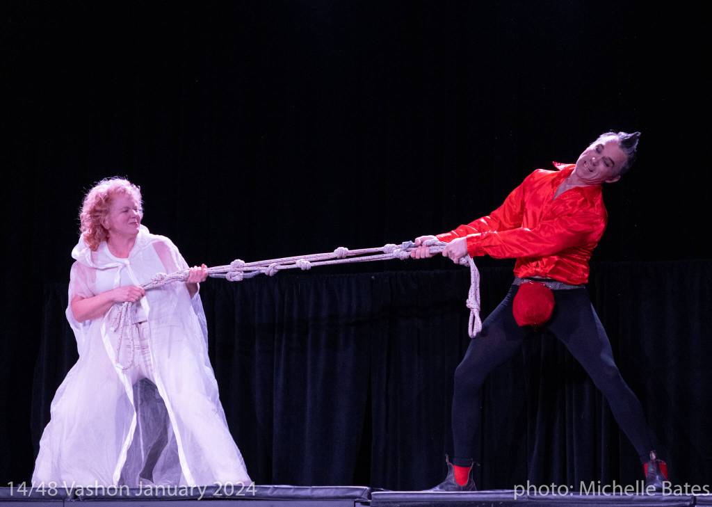 Juniper Rogneby and Jon Kuzma, playing the roles of God and Satan in one of 14 new plays that was written in 48 hours for last years 14/48 Vashon festival. This years edition of the festival will take place on Jan. 23 and 24, at Open Space. (Michelle Bates Photo)