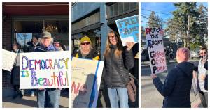 Tess Halpern Photos
Protesters gather at Vashons four-way stop Tuesday to mark the one-year anniversary of President Donald Trumps second term, beating drums and buckets as passing drivers honked in support.