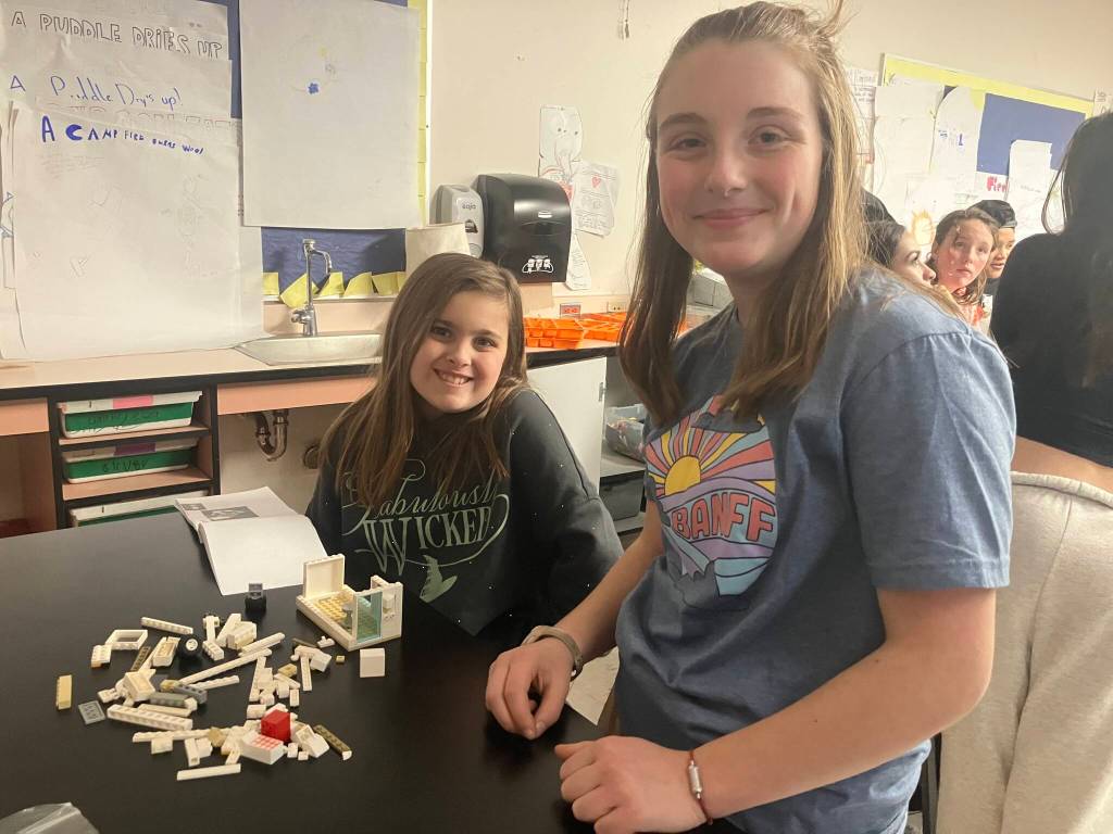 Eighth-grader Eliza (right) designed a travel trailer for her fifth-grade Lego buddy, Eleanor. (Elizabeth Shepherd Photo)