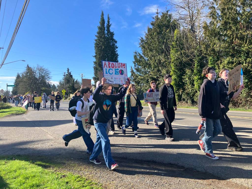 Elizabeth Shepherd Photo
The march to town from the school district campus passed by Moms Deli, where a King County Sheriffs Office deputy was stationed to keep an eye on the kids.