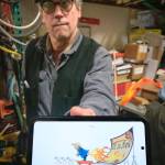 Bill Moyer holds an artists rendering of the new protest piece. (Terry Donnelly Photo)