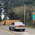 Cars prepare to turn left from Vashon Highway onto 103rd Avenue Southwest, the route to the Southworth ferry. (Eric Pryne Photo)