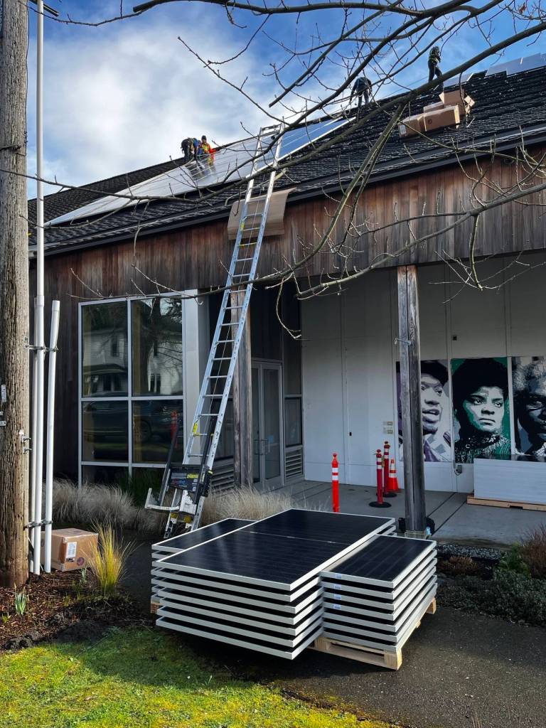 Workers install a new solar photovoltaic system at Vashon Center for the Arts Kay White Hall. (Kevin Jones Photo)