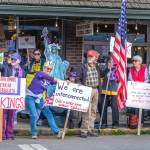 Islanders packed into a corner of Vashons four-way stop and held up signs during the March 28 No Kings protest. (Terry Donnelly Photo)