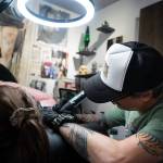 Tyler Kaltreider tattooing a client  the shop stocks only vegan and cruelty free inks.