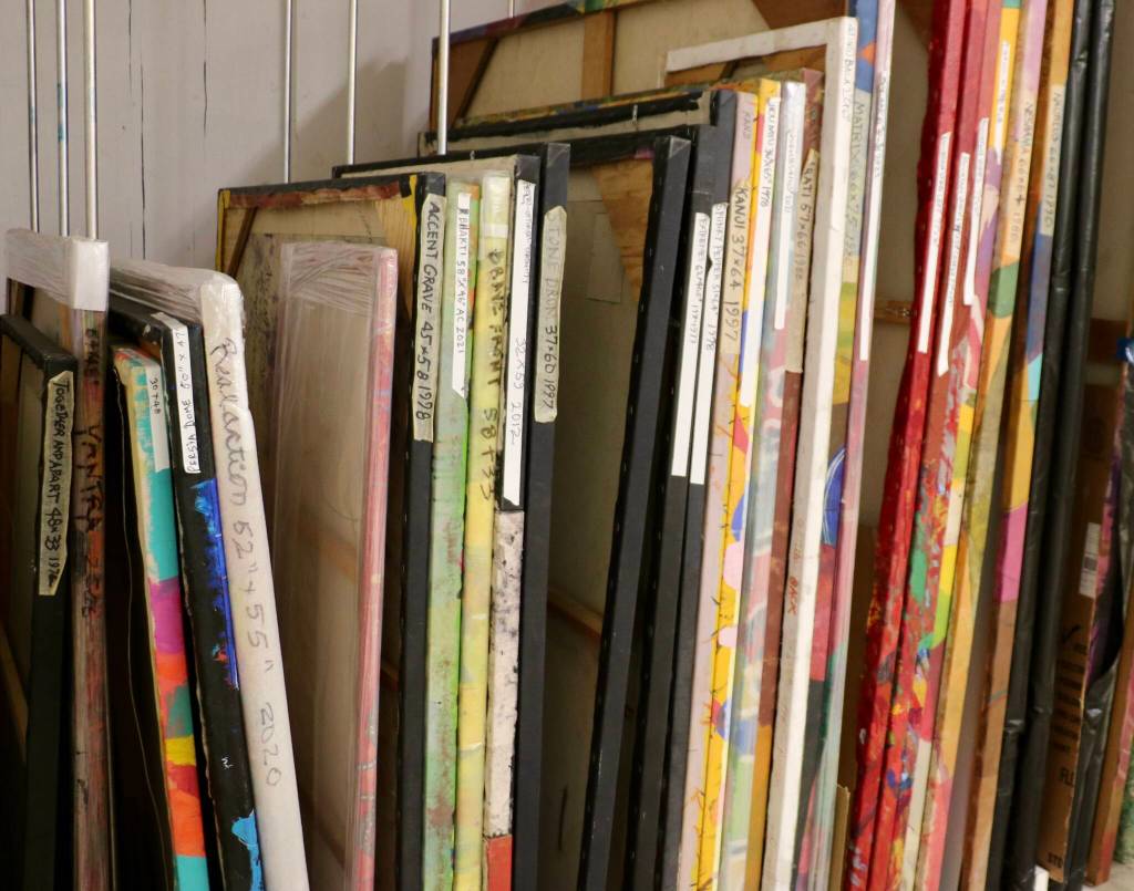 Dozens of canvasses fill various nooks in Donald Coles island studio.