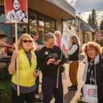 Kent Phelan Photos
Islanders gathered with signs outside the Hardware Store Restaurant during a May Day action at Vashons four-way stop on Friday, May 1.