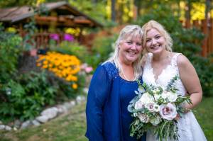 Courtesy Photos
Dayna Jessen-Rogers (left) and her daughter, Mallory Groth, pose during Groths 2021 wedding on the familys Vashon property. The event inspired the pair to create Woodland Gardens, an outdoor wedding and event venue they now run together.