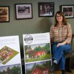 Terry Donnelly Photo
Jennifer Potter inside the future Heights Grocery with a rendering of the store.