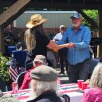 Courtesy Photo
Visitors enjoy food and community connection during last years Memorial Day gathering at the Vashon Senior Center.
