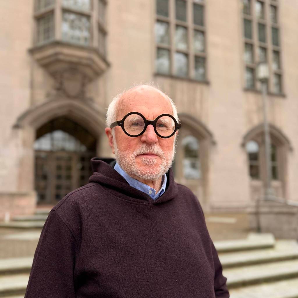Anaelsin Lopez Photo
Award-winning photography instructor Ray Pfortner poses outside Red Square on the University of Washington campus in Seattle.