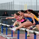 Tony Puz Photos
Vashons Lena Puz (pink jersey) races toward a second-place finish in the 100-meter hurdles at the WIAA 1A State Track and Field Championships in Yakima. The Cornell-bound senior broke her own school record with a time of 15.19 seconds and finished her career with three state podium finishes.