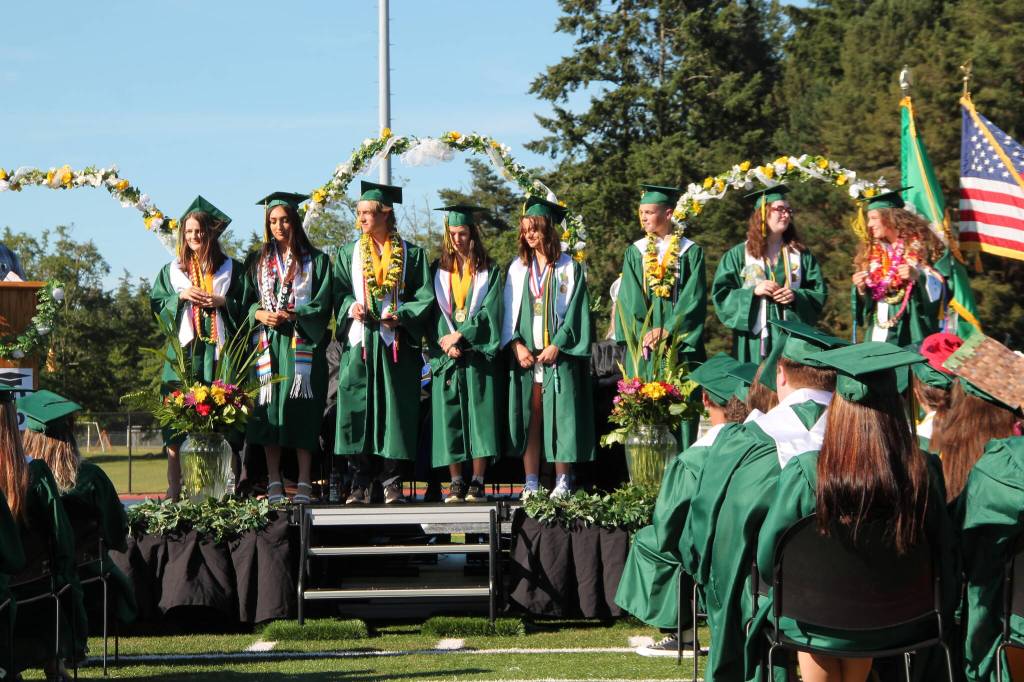 Pieces of Eight Award recipients Emma J. Campbell, Anahi Carolina Nunez Hernandez, Dashiel Brady Palermo, Emily Marie Harrington, Surton Claire Archambault, Conor Patrick Delcamp, Delilah Evangelina Spence and Persephone Lena Helen Puz stand together during Vashon High Schools commencement ceremony Saturday.