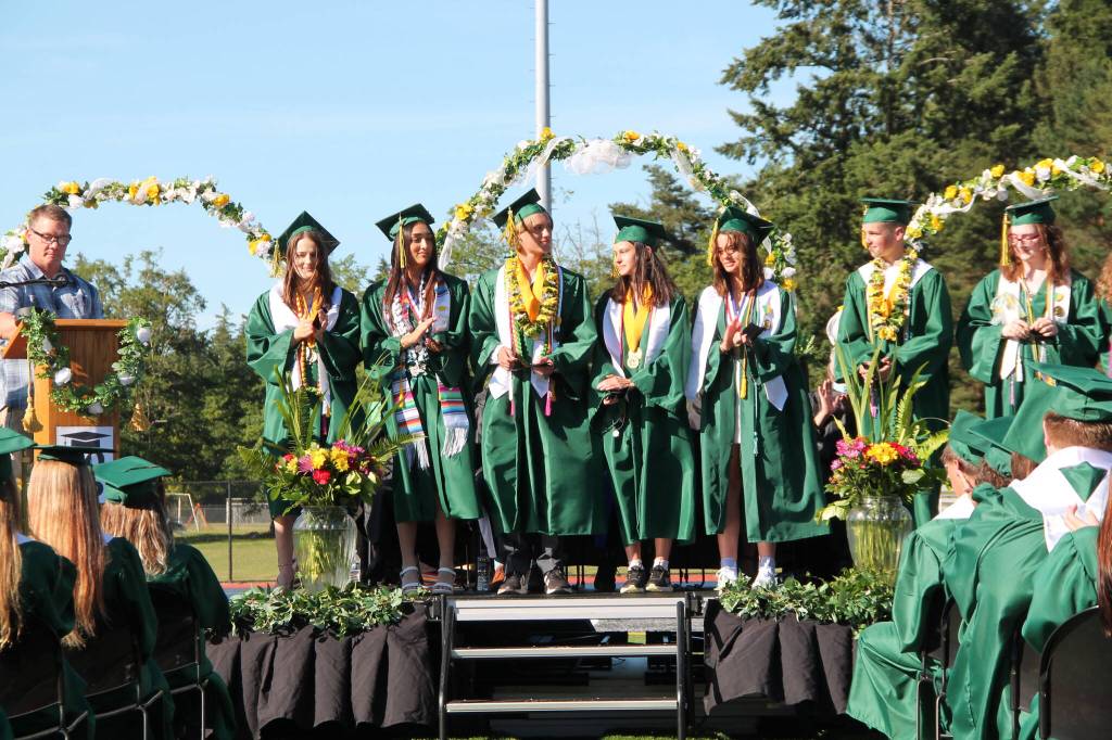 Pieces of Eight Award recipients Emma J. Campbell, Anahi Carolina Nunez Hernandez, Dashiel Brady Palermo, Emily Marie Harrington, Surton Claire Archambault, Conor Patrick Delcamp, Delilah Evangelina Spence and Persephone Lena Helen Puz stand together during Vashon High Schools commencement ceremony Saturday.