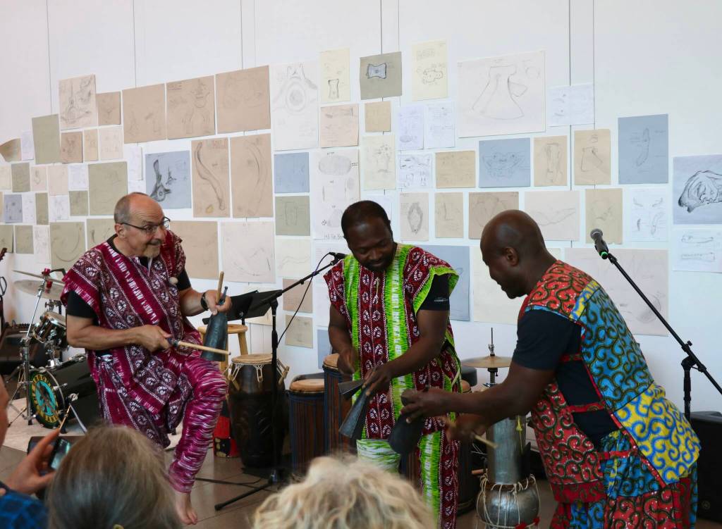 Scarlet Hansen Photo
Seattle-based West African performing arts group Gansango play the Gankogui.