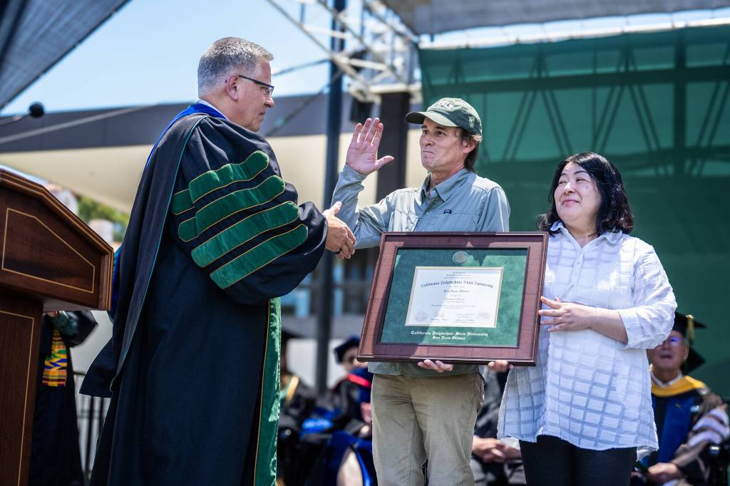 Jay Thompson Photo
Carl Hillman and Mayumi Ogawa accept a posthumous degree for their son, Sean Ogawa Hillman, from Cal Poly President Jeffrey D. Armstrong during the universitys June 14 commencement ceremony.