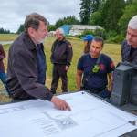 Terry Donnelly Photo
Standing near the current grassy landing area, Vashon Island Fire & Rescue officials and airport commissioners reviewed plans for a new emergency helipad at Vashon Municipal Airport.