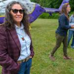 Terry Donnelly Photo
Seattle Indian Health Board President and CEO Esther Lucero (Diné) stands near the current grassy landing area at Vashon Municipal Airport, where a new emergency helipad is expected to be completed by the end of September.