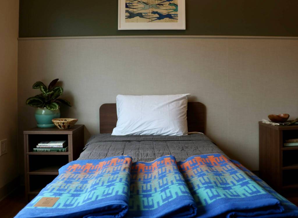 Scarlet Hansen Photo
Resident bedrooms feature soft lighting, plants and wood accents.