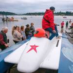 Terry Donnelly Photo
Islanders gather around a hydroplane at Jensen Point as crews prepare boats for Vashons annual Fourth of July race around the island.