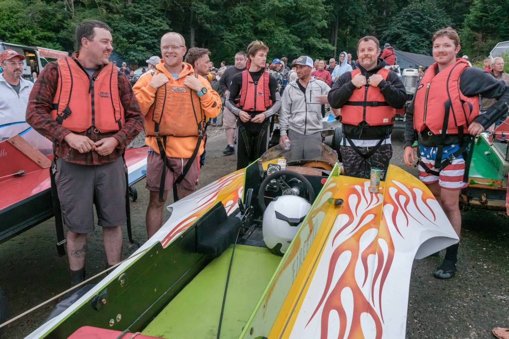 Terry Donnelly Photo
Hydroplane racers fasten their life vests at Jensen Point before Vashons annual Fourth of July race around the island.