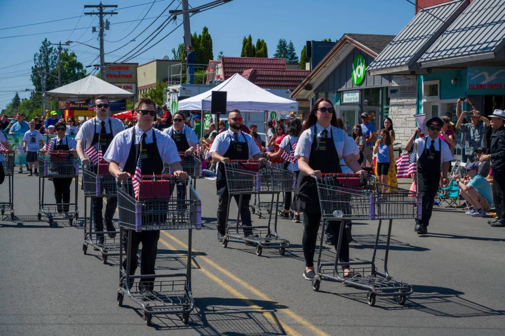 Kent Phelan Photo
Members of the Thriftway Shopping Cart Drill Team perform in the 2017 Strawberry Festival parade.