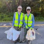 Courtesy Photo
Armed with litter grabbers, bright yellow safety vests and vintage Bartell Drugs bags, Deborah Diamond (left) and Elizabeth Boutin have made roadside cleanup part of their daily routine on Vashon.