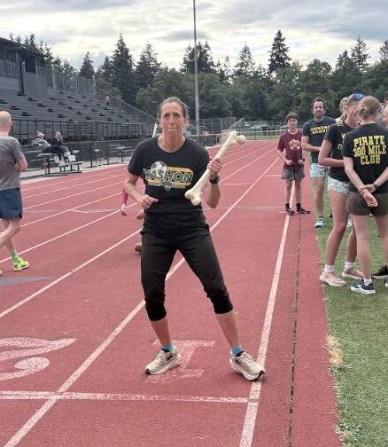 James Batey Photo
Megan Henderson carries a baton.