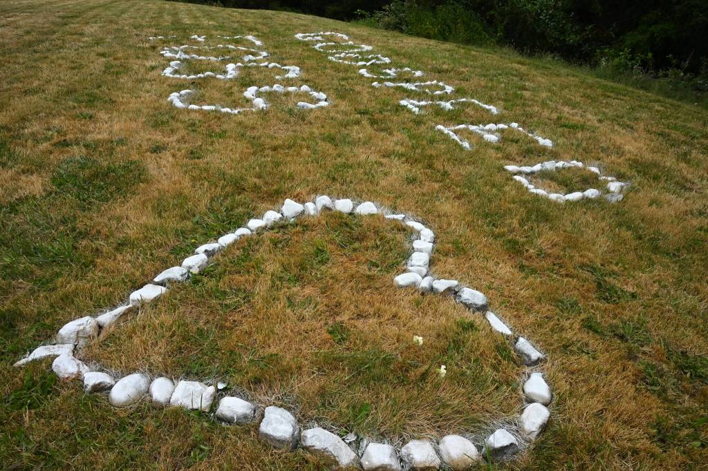 Kent Phelan Photo
Spray-painted rocks arranged on the grass honored Foss Miller during the inaugural Foss Miller Memorial All-Comers Track Meet at Vashon High School.