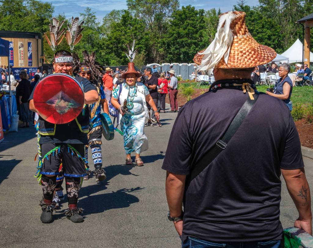 Terry Donnelly Photo
The intertribal Blue Lightning Canoe Family, formerly known as the Blackhawk Dancers, perform songs and drumming to open Saturdays ceremony at the Thunderbird Treatment Center.