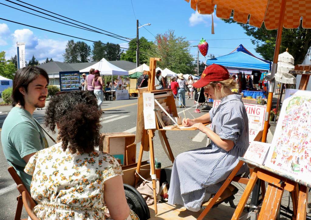 Scarlet Hansen Photo
Island artist Michelle Lassaline illustrates a You as an Animal portrait on Saturday.