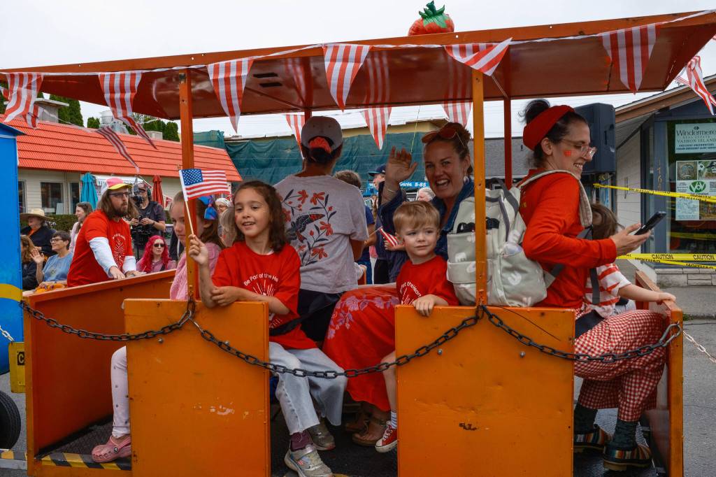 Kent Phelan Photo
Festivalgoers wave from aboard the Strawberry Festival train.