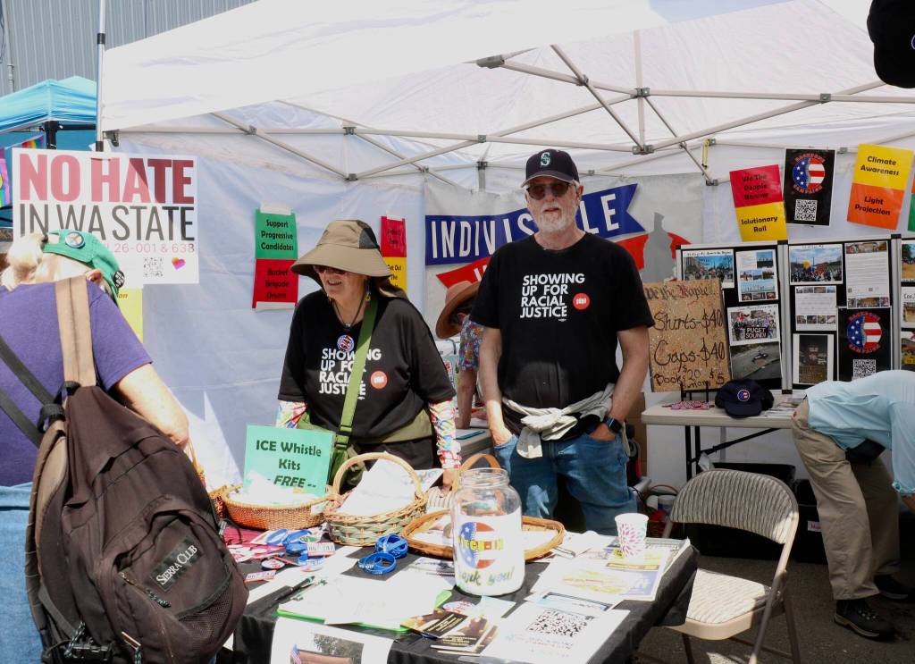 Scarlet Hansen Photo
Indivisible Vashon hands out ICE whistle kits, bracelets and voter information during the Strawberry Festival.