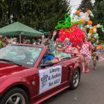 Kent Phelan Photo
Indivisible Vashon members wave from a convertible as a giant strawberry and bubbles fill the parade route.