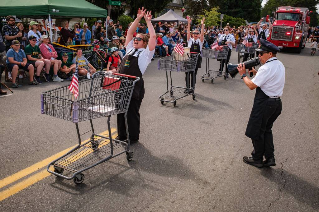Kent Phelan Photo
Thriftways Shopping Cart Drill Team performs its routine as a leader calls commands through a megaphone.