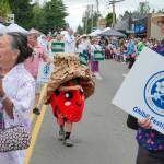 Jonathan Stein Photo
Marshall the Strawberry, Vashons newly elected unofficial mayor, strolls through uptown during the Strawberry Festival Parade on Saturday.
